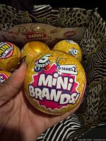 Front view of Series 2 Mini Brands ball showing logo