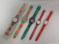 All five Swatch watches displayed side by side
