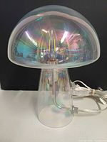Full view of iridescent mushroom glass lamp, cord visible