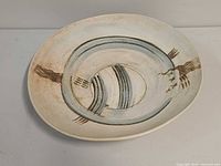 Top view of stoneware oval dish showing full decoration