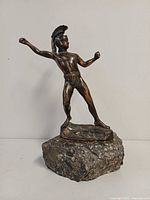 Front view of bronze Leonidas on stone base