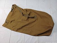 Full view of duffle bag front side showing overall condition, strap and closure