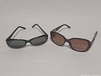 Both pairs side by side: Nicole Miller (right) Foster Grant (left)