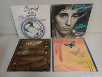 Front covers of all four records