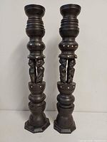 Front view of both carved candlesticks