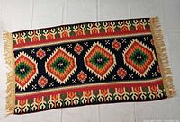 Full view of kilim rug showing pattern and fringe