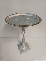 Full view of cast metal side table front