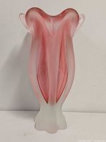 Front view of pink and white art glass vase