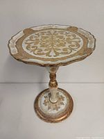 Full view of table from top angle showing ornate design and overall condition