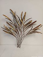 Full view of metal wheat wall sculpture