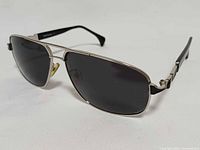 Full view of sunglasses showing frame, lenses, and temples