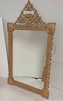 Full view of ornate gold gilt mirror