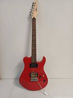 Full view of red Yamaha ERG121C electric guitar front