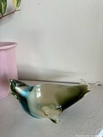 Side view showing blue and olive colour gradation of glass seal