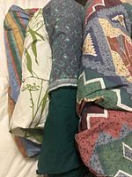 Four folded duvet covers showing assorted patterns