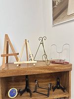 Group shot of all easels and stands on shelf