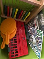 Abacus, paddles, Trouble board, red panel in bin