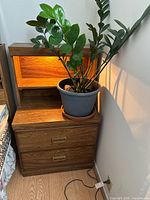 Stacked nightstand shown with lamp on and plant removed
