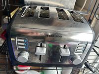 Front view of Black+Decker 4-slice toaster showing controls and levers