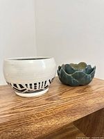 Both pottery pieces side by side
