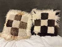 Both sheepskin patchwork pillows front view