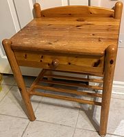 Front and side view of pine table showing drawer, legs and lower shelf