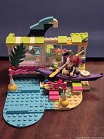 Front view of assembled surf shop with kayak and minidoll