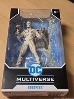 Front view of sealed Godspeed figure in DC Multiverse window box.