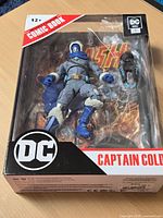 Front view of sealed Captain Cold Page Punchers figure in box