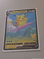 Front view of Surfing Pikachu V card showing image, HP 200, Surf 150, set code 008/025
