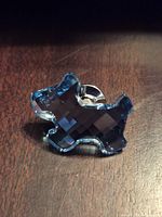 Front view of blue crystal dog brooch
