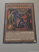 Front of Dark Magician of Chaos card showing title, artwork, stats and set code