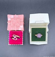 Both rings in their boxes