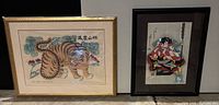 Front view of both framed prints: tiger and warrior