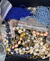 Pile of assorted necklaces showing bead and shell styles