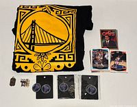 All items together: T-shirt, trading cards stack, Valkyries earrings and necklace, sterling pendant, enamel pin