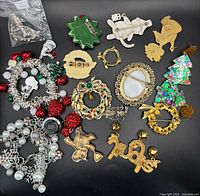 Full lot overview showing variety of pins, bracelets, parts bag