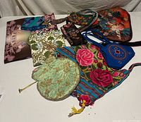 Top view of all eight bags, clutches and wallets