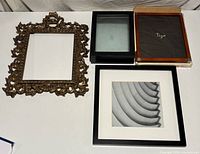 All four picture frames on tabletop