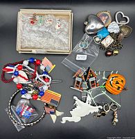 Group shot of entire jewellery lot showing variety of holiday themed items
