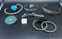 Front view of all eight turquoise jewellery pieces