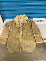 Full view of front showing corduroy fabric, shearling collar, pockets