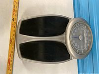 Top view of Health o meter scale including foot pads and measuring tape for scale