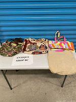 Overview of all five tote bags on table
