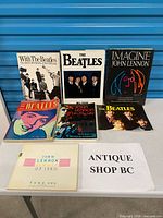 All seven books laid out on table