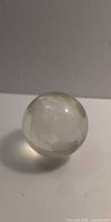 Clear glass globe showing etched continents