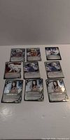 All nine Naruto CCG cards arranged in three rows