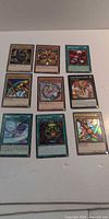 All nine Yu-Gi-Oh! cards laid out in 3×3 grid