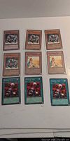 Nine Yu-Gi-Oh! cards laid out in three rows of three
