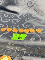 Seven 1967 Canadian pennies in a row on fabric